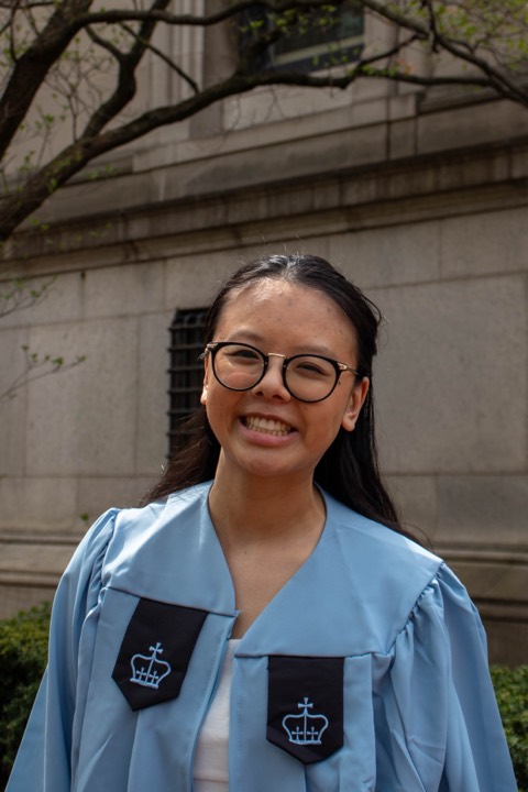 Emma Li in Columbia University graduation regalia on campus